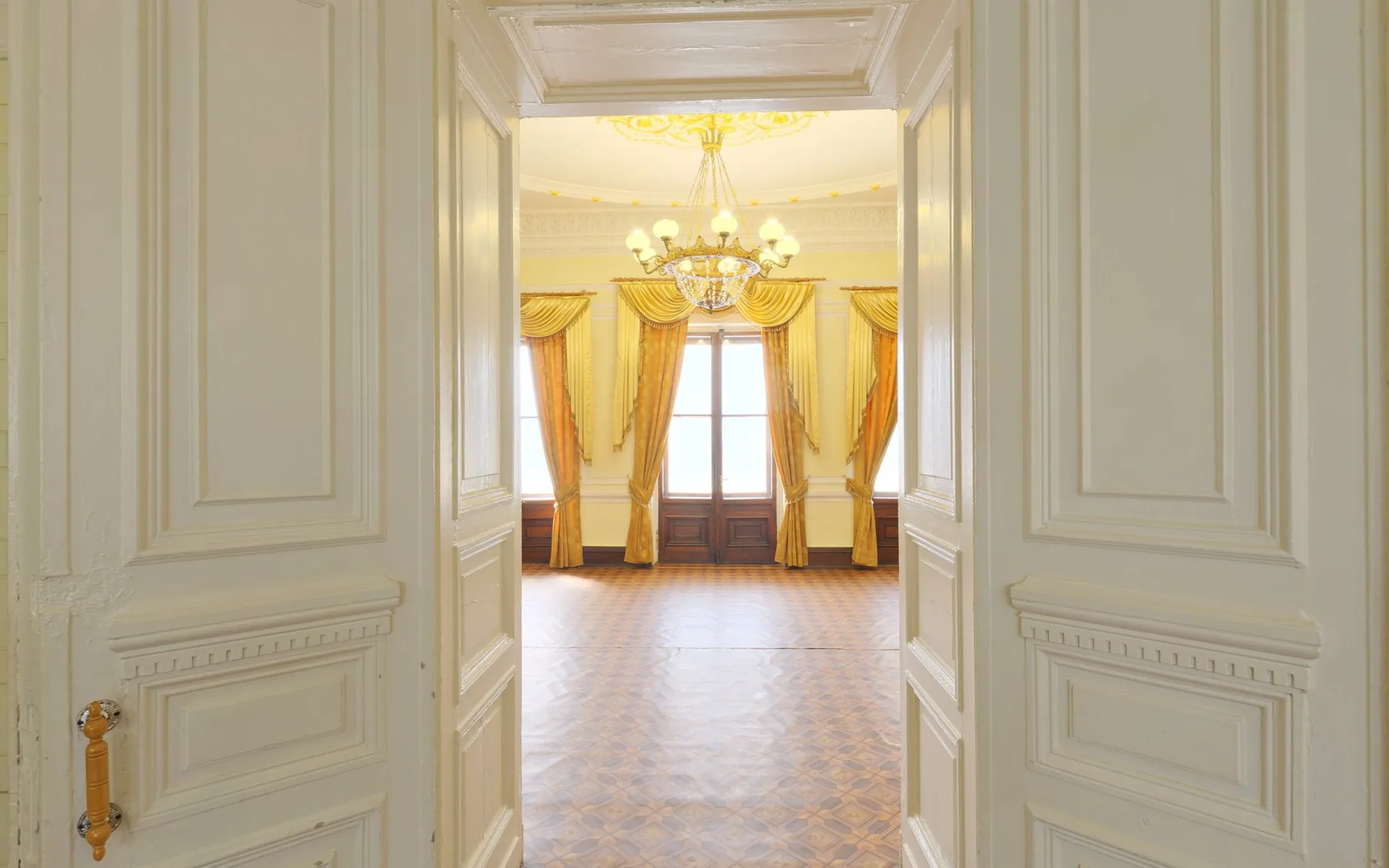Warm light and intricate architectural details in the demonstration entrance hall