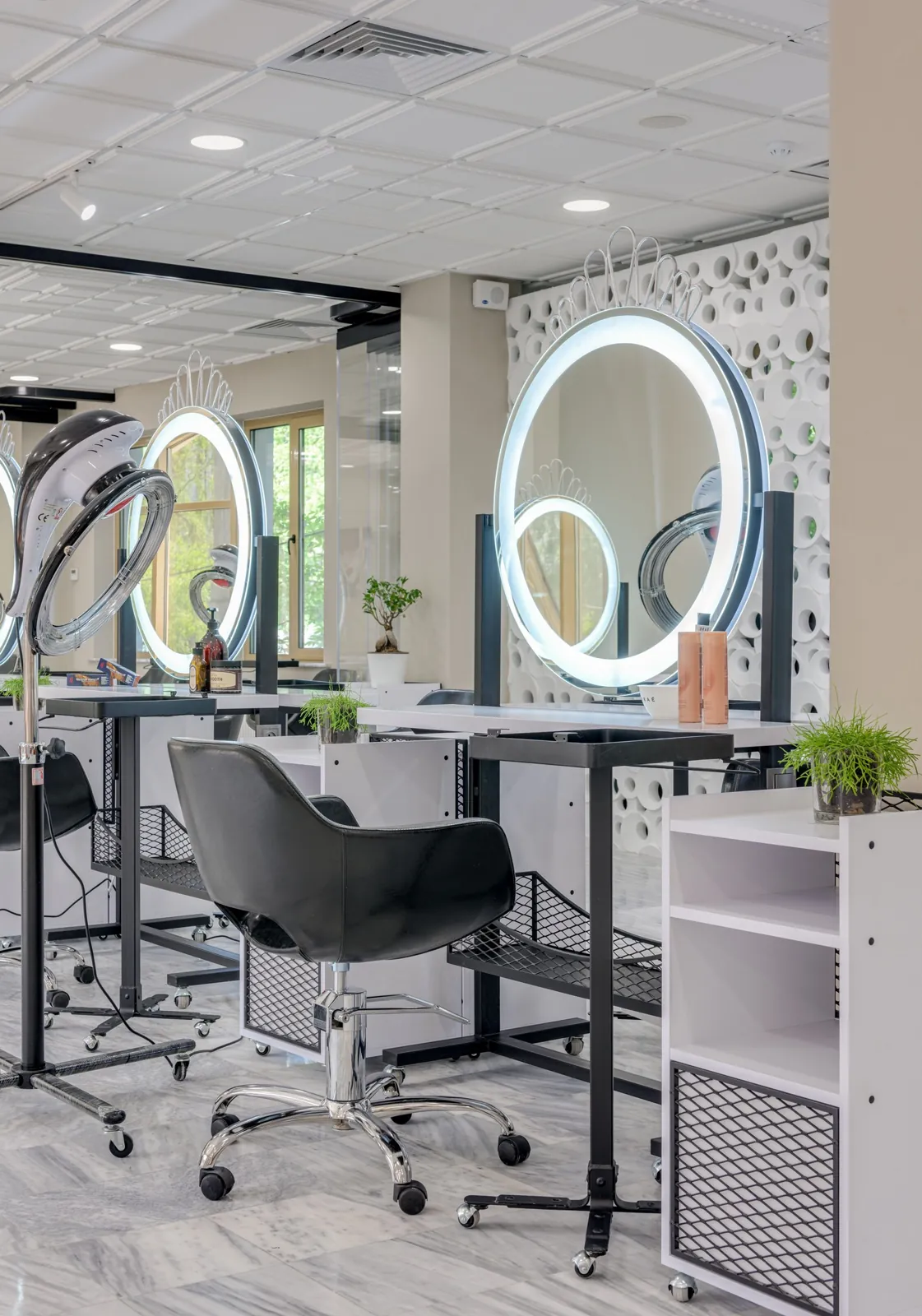 Salon interior with illuminated circular mirrors